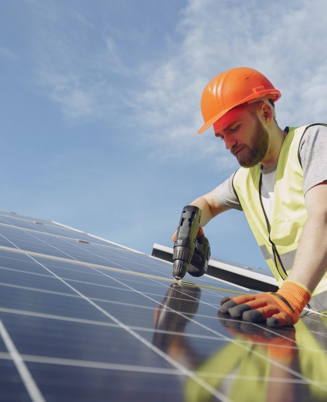 A man installing Solar panels